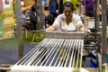Woman weaving Philippine traditional cloth at Philippine Travel Mart Event, Manila, Philippines, Sep 1, 2019