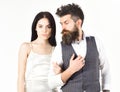 Woman in wedding dress and man in vest. Couple in love, bride and groom in elegant wedding clothes, white background Royalty Free Stock Photo