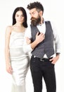 Woman in wedding dress and man in vest. Wedding concept. Couple in love, bride and groom in elegant wedding clothes Royalty Free Stock Photo