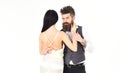 Woman in wedding dress with nude back and man in vest. Hipster with lady dressed up, copy space. Couple in love, bride Royalty Free Stock Photo