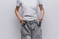 Woman On A Weight Loss Diet Large Pants Measuring A Slim Figure