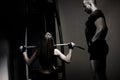 Woman weight training at gym.Exercising on pull down weight machine/ Royalty Free Stock Photo