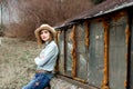 Woman in western wear in cowboy hat, jeans and cowboy boots. Royalty Free Stock Photo