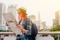 Woman westerner looking at map during city tour in the morning, Royalty Free Stock Photo