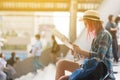 Woman westerner looking at map during city tour in the morning, Royalty Free Stock Photo