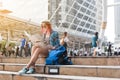 Woman westerner looking at map during city tour in the morning, Royalty Free Stock Photo