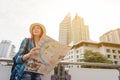 Woman westerner looking at map during city tour in the morning, Royalty Free Stock Photo