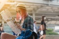Woman westerner looking at map during city tour in the morning, Royalty Free Stock Photo