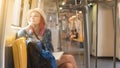 Woman westerner admire view from train`s window Royalty Free Stock Photo