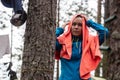 Woman with wet hair, after swimming in the lake, dries her head with a towel, in the forest, in the camp, on a summer Royalty Free Stock Photo