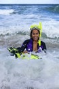 Woman in wetsuit excited to be going snorkeling