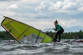 Woman learning how to windsurf
