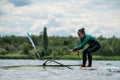 Woman learning how to windsurf