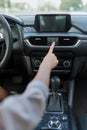 Woman wheel of car presses emergency stop button, activating signal about an accident and road traffic accident road Royalty Free Stock Photo