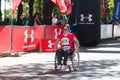 Woman wheelchair competitor at half-marathon in Odessa