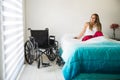 Woman in wheelchair feeling optimistic Royalty Free Stock Photo
