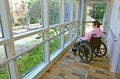 Woman in a Wheelchair Gazing Outside