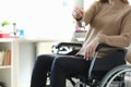 Woman in wheelchair holding apartment key closeup