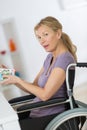 woman in wheelchair at home Royalty Free Stock Photo