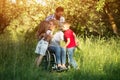 Woman in wheelchair kisses her son among family members Royalty Free Stock Photo