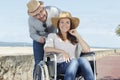 woman in wheelchair man looking at camera Royalty Free Stock Photo