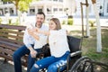 Woman in wheelchair taking selfie with a guy Royalty Free Stock Photo