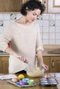 Woman whisking batter in kitchen Royalty Free Stock Photo