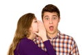 Woman whispering into man's ear