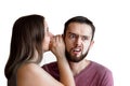 Woman is whispering a secret into her friends ear Royalty Free Stock Photo