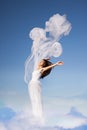 Woman in white above the sky Royalty Free Stock Photo