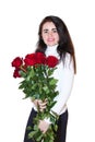 Woman on a white background with a bouquet of roses