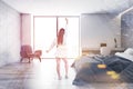 Woman in white bedroom with home office Royalty Free Stock Photo