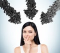 Woman in white and black arrows of question marks Royalty Free Stock Photo