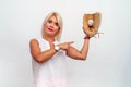 Woman in a white blouse caught a baseball ball with a glove Royalty Free Stock Photo