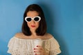 Woman in white blouse and sunglasses with red lipstick and nail Royalty Free Stock Photo