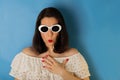 Woman in white blouse and sunglasses with red lipstick and nail Royalty Free Stock Photo