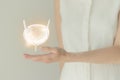 Woman in white clothes holding virtual bladder in hand. Handrawn human organ, detox and healthcare, healthcare hospital service