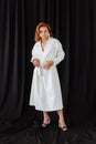 A woman in white coat