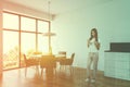 Woman in white dining room corner Royalty Free Stock Photo