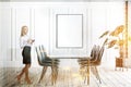 Woman in white dining room interior with poster Royalty Free Stock Photo