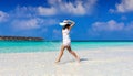 Woman in white dress enjoying the tropical setting