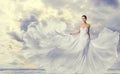 Woman White Dress, Fashion Model in Long Silk Fluttering Gown, Waving Flying Cloth on Wind Royalty Free Stock Photo