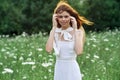 Woman in white dress in a field walk flowers vintage nature