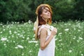 Woman in white dress in a field walk flowers vintage nature