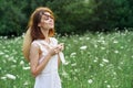 Woman in white dress in a field walk flowers vintage nature