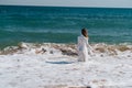 Woman in white dress freedom walk on ocean island Royalty Free Stock Photo