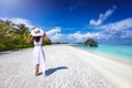 A woman with a white dress on holiday in the Maldives Royalty Free Stock Photo