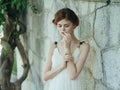 Woman in white dress outdoors in Greece decoration