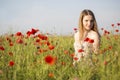 Woman at white dress posing on field