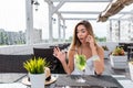 Woman white dress summer cafe calling phone, surprised shock, bewilderment. Surprise delight, conversation smartphone Royalty Free Stock Photo